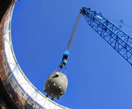 Crane lifting piece of nuclear plant