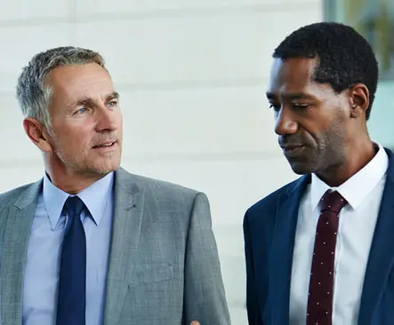Two business people wearing suits
